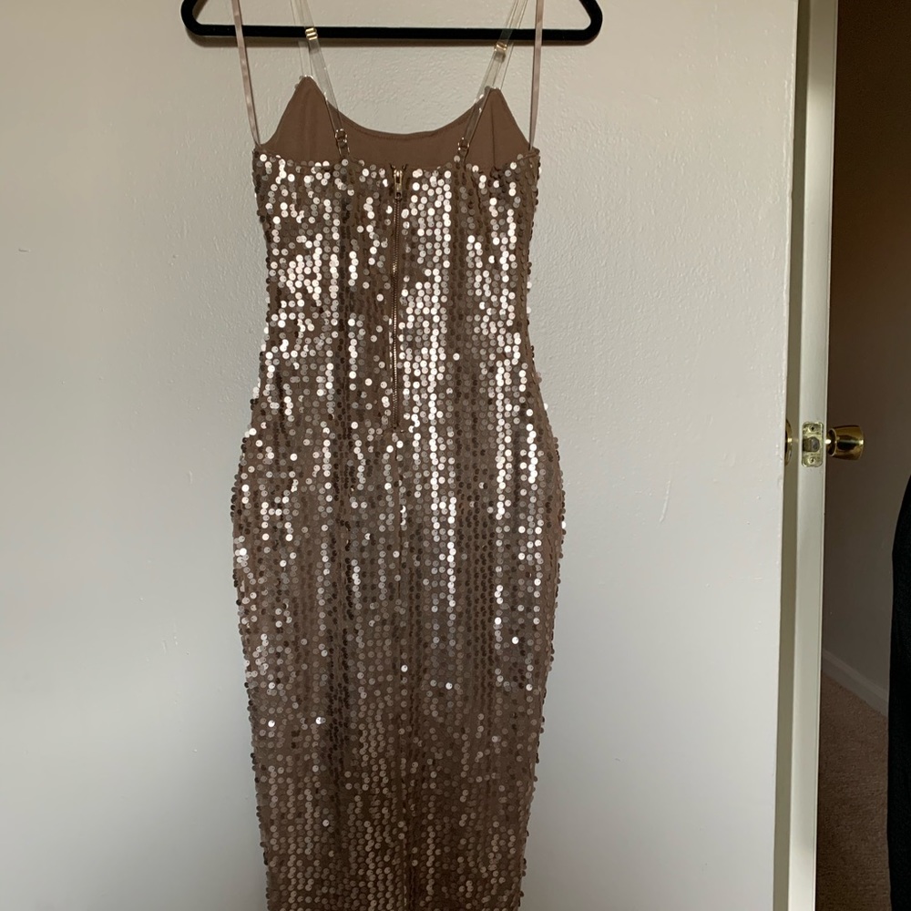 Sequin, gold, form fitting dress.